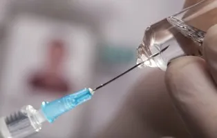 Doctor holding syringe and getting ready for injection; Shutterstock ID 48547438; PO: aol; Job: production; Client: drone
