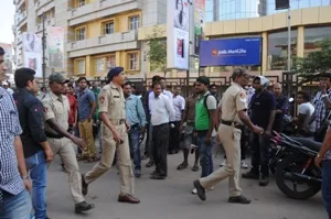 Policemen led by DCP Satyabrata Bhoi at the Bhabani Mall  Pic: Biswaranjan Mishra