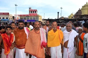Daitapatis on their way to the Markanda pond for a ritual bath after coming out of the Jagannath temple at the end of the marathon exercise of Brahma Parvartan on Tuesday evening  (OST Photo)