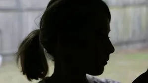minor girl in silhouette
