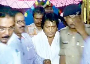 Sarathi Baba being taken away by Crime Branch sleuths from his ashram