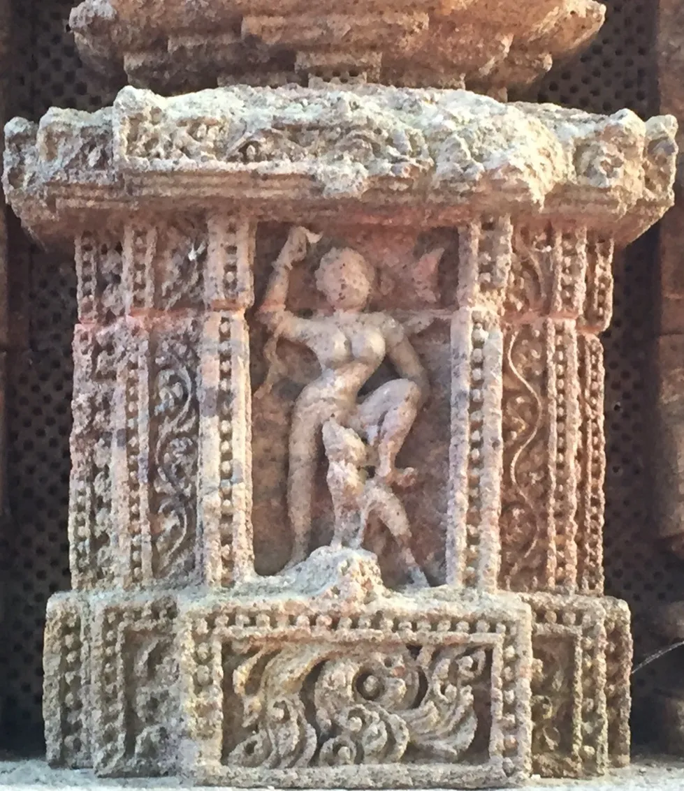 An eroded structure of a woman and a dog