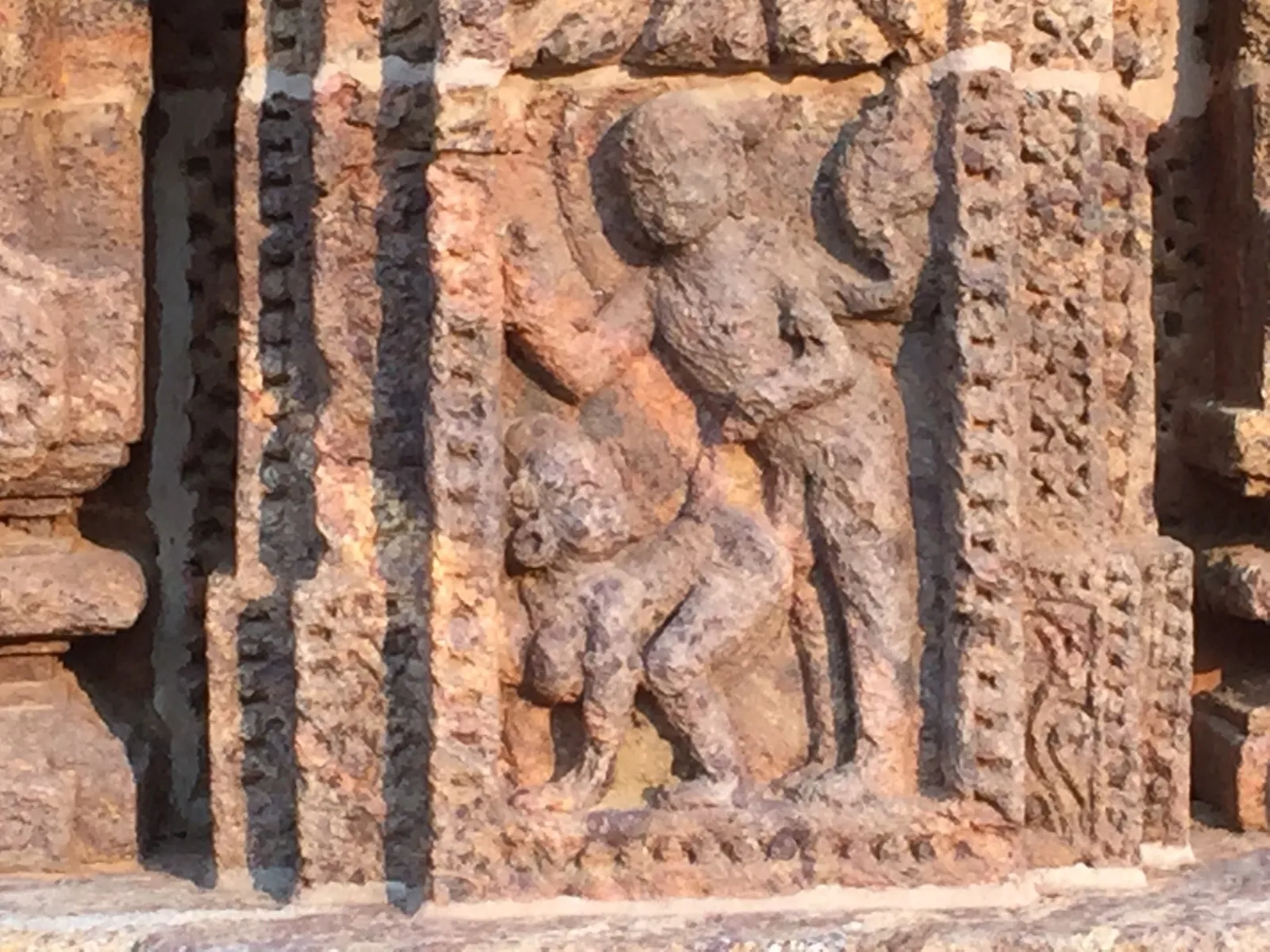 Eroded depiction of anal intercourse between a man and a pregnant woman