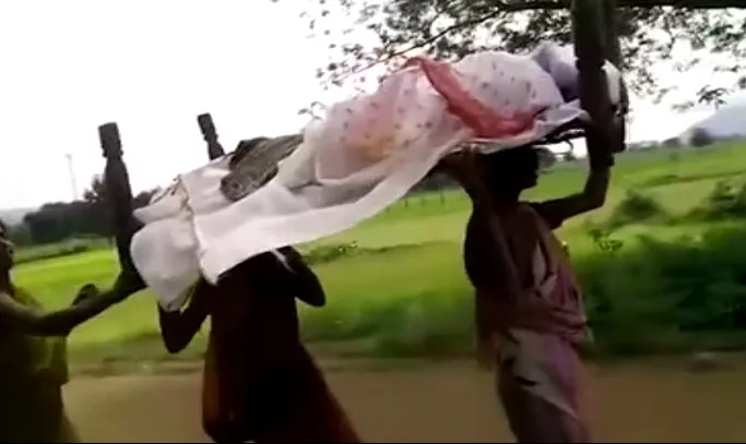 sisters-carry-mother-on-cot