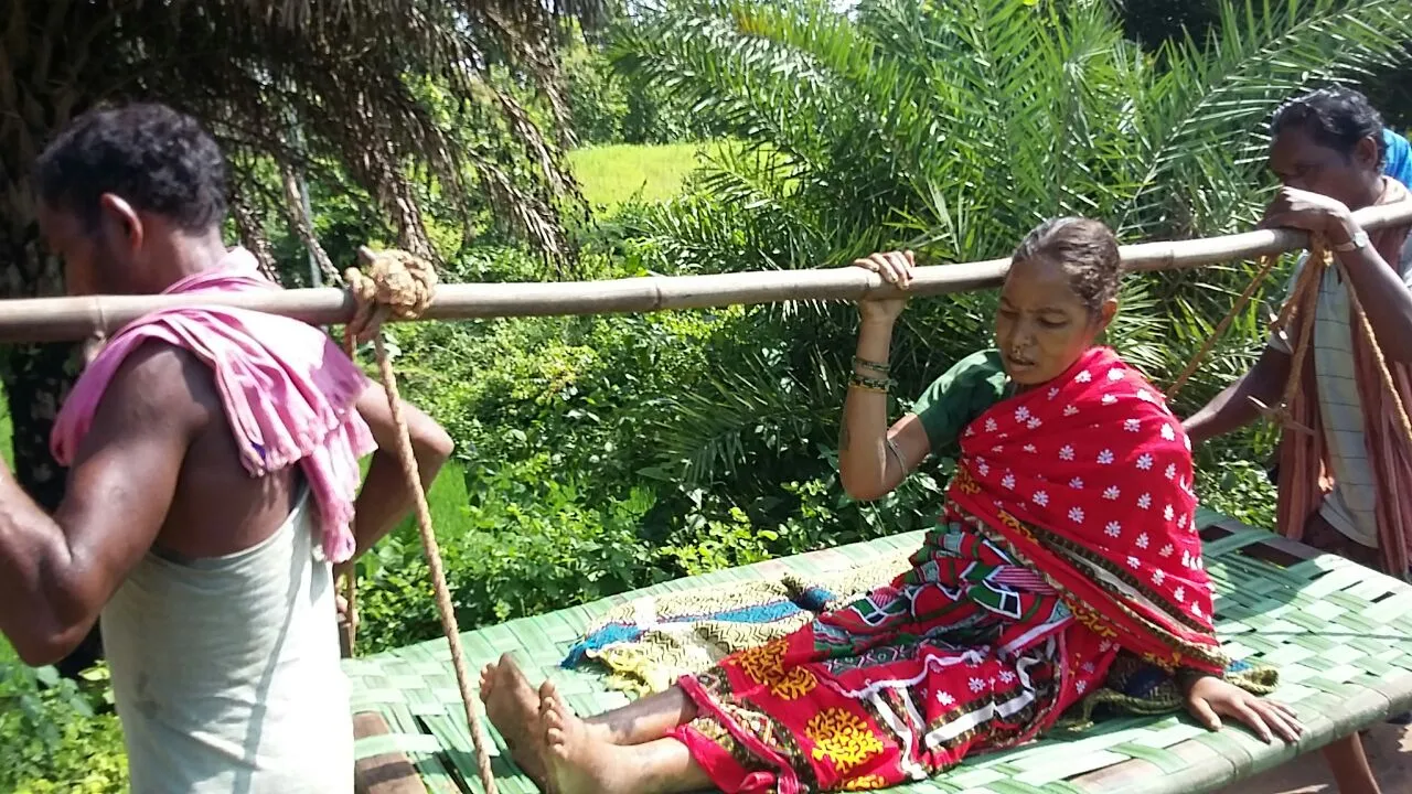 woman-carried-on-cot