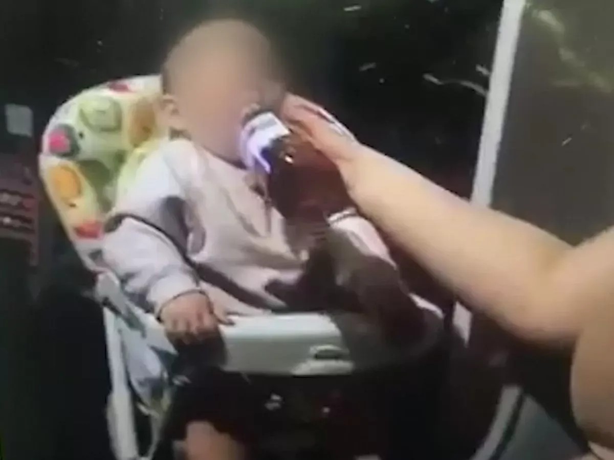 Horrifying moment crying baby 'fed wine' from bottle by mum as friend filmed it - Mirror Online