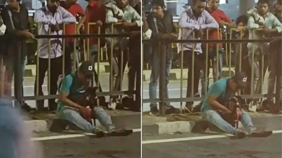 कुत्ते को सीने से लगाकर रोता रहा युवक. (Photo: Video Grab)