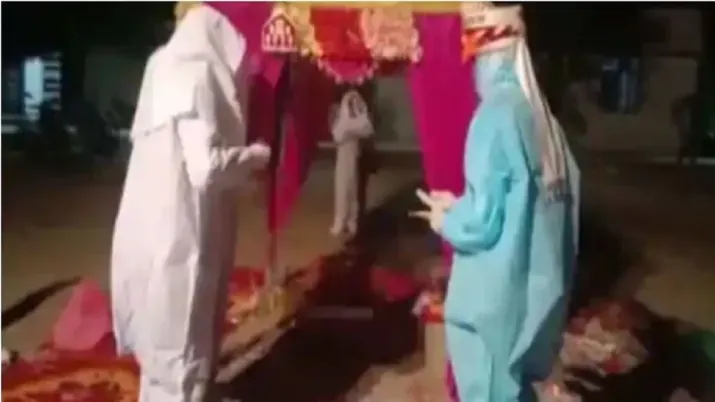 Rajasthan couple gets married in PPE kits after bride tests Covid positive on wedding day | WATCH | India News – India TV