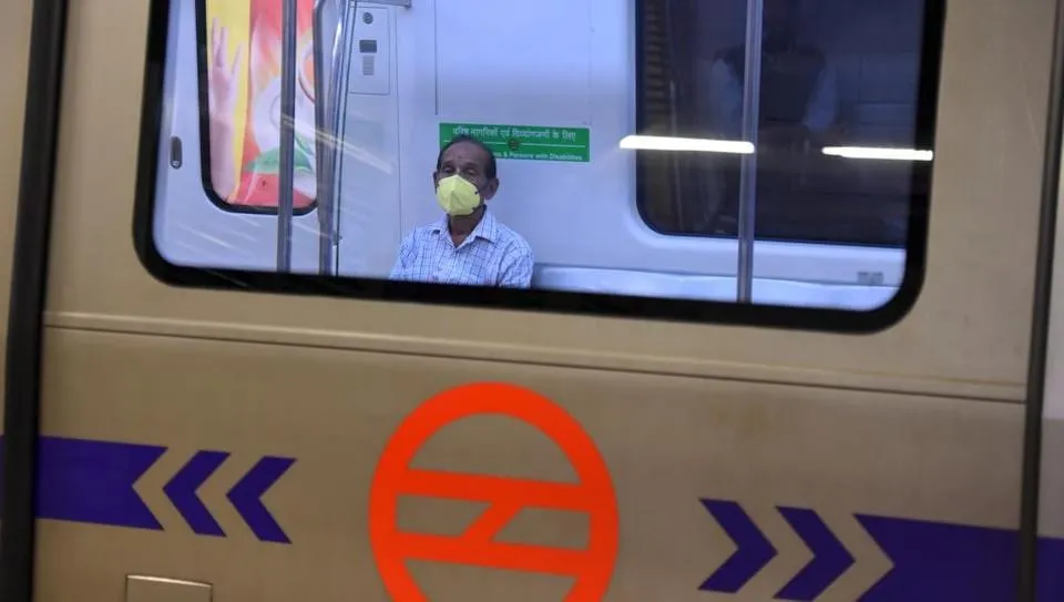 Commuters wearing face masks or with their faces generally covered as a precautionary measure against coronavirus infections, at Rajiv Chowk Metro Station in New Delhi, India, on Friday, March 20, 2020.
