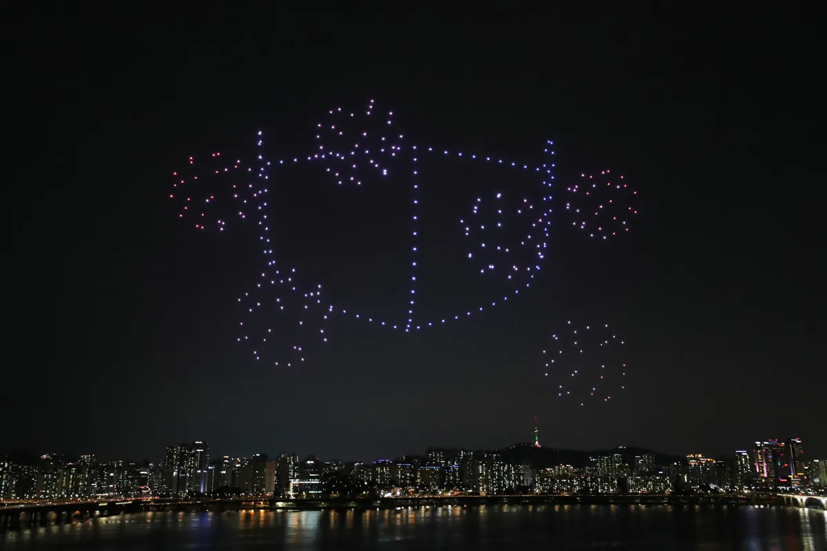 The drones created images of a mask surrounded by coronavirus particles. <South Korea's Ministry of Land, Infrastructure and Transport/Handout via Reuters>