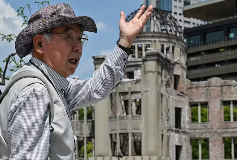 Atomic bomb survivor Masao Ito, 82, speaks at the park across from the Atomic Bomb Dome in Hiroshima in May 15, 2023. Richard A. Brooks/AFP via Getty Images