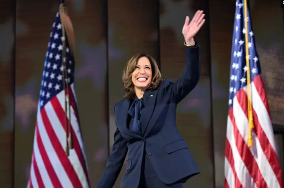 Kamala Harris arrives to speak at the Democratic National Convention on Aug. 22, 2024, wearing a dark blue pantsuit. Saul Loeb/AFP via Getty Images