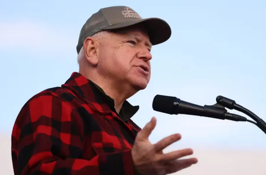 Tim Walz speaks at a campaign rally in Volant, Pa., on Oct. 15, 2024, wearing one of his signature flannel shirts. Michael M. Santiago/Getty Images
