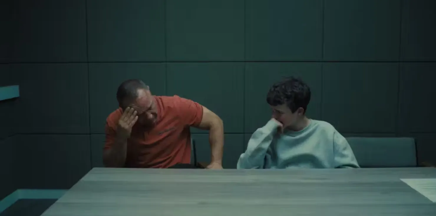 Jamie’s father protests against his strip-search by two male officers. Courtesy of Netflix