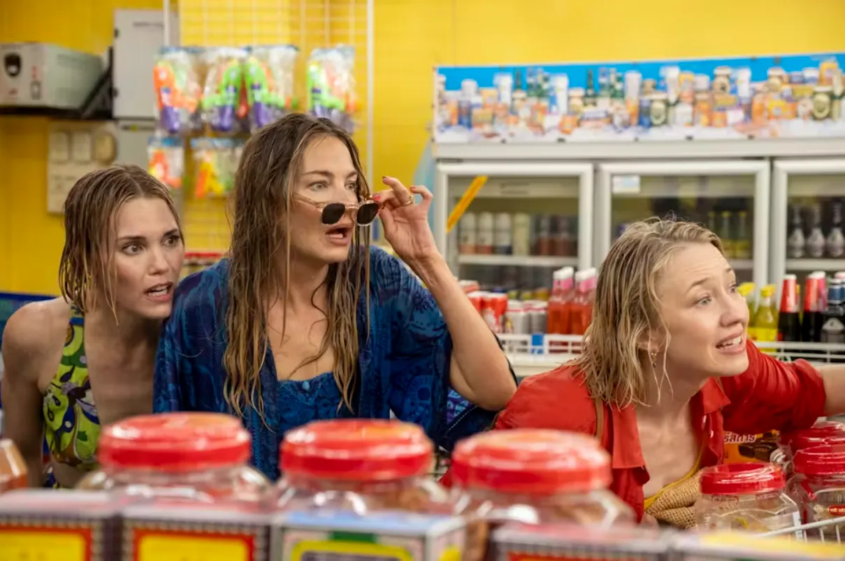 Jaclyn (Michelle Monaghan), Piper (Sarah Catherine Hook) and Laurie (Carrie Coon) are unhappy to be soaked by locals with water guns – in what is one of few genuinely authentic experiences with locals. Warner Bros