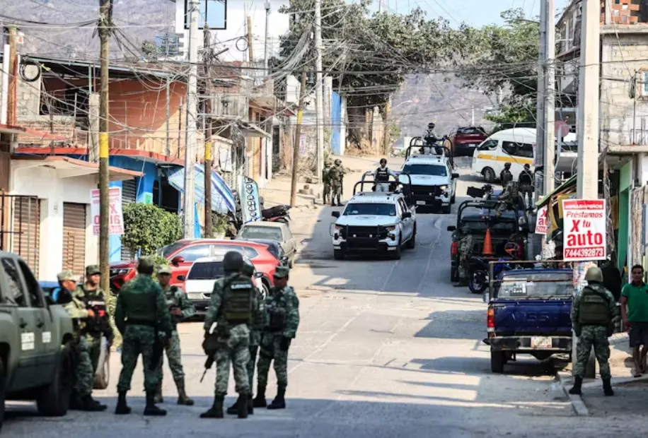 Members of the National Guard and Mexican Army guard an area where four dismembered bodies were found in Acapulco, Mexico, in May. David Guzman/EFE/EPA