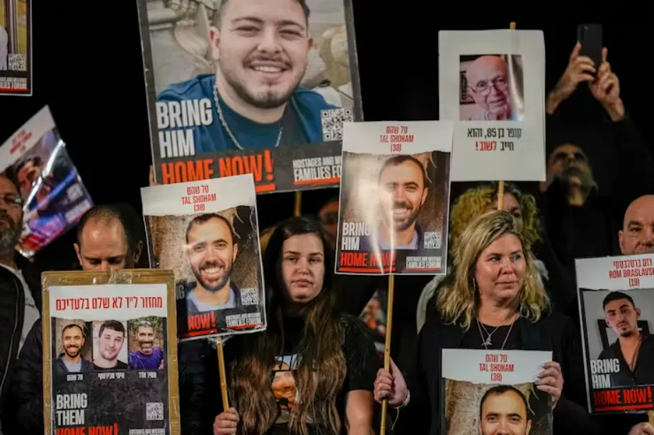 Families and supporters of Israeli hostages held by Hamas in Gaza at a rally in Tel Aviv in December. Ariel Schalit/AP