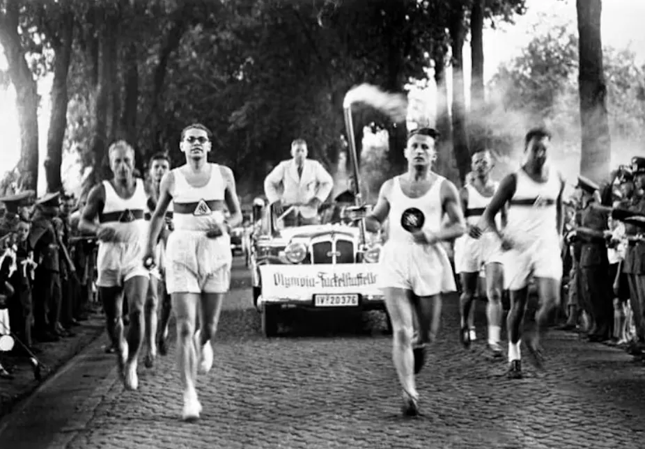 The torch relay and lighting of the Olympic flame at the 1936 Summer Olympics in Berlin. German Federal Archives, CC BY-ND