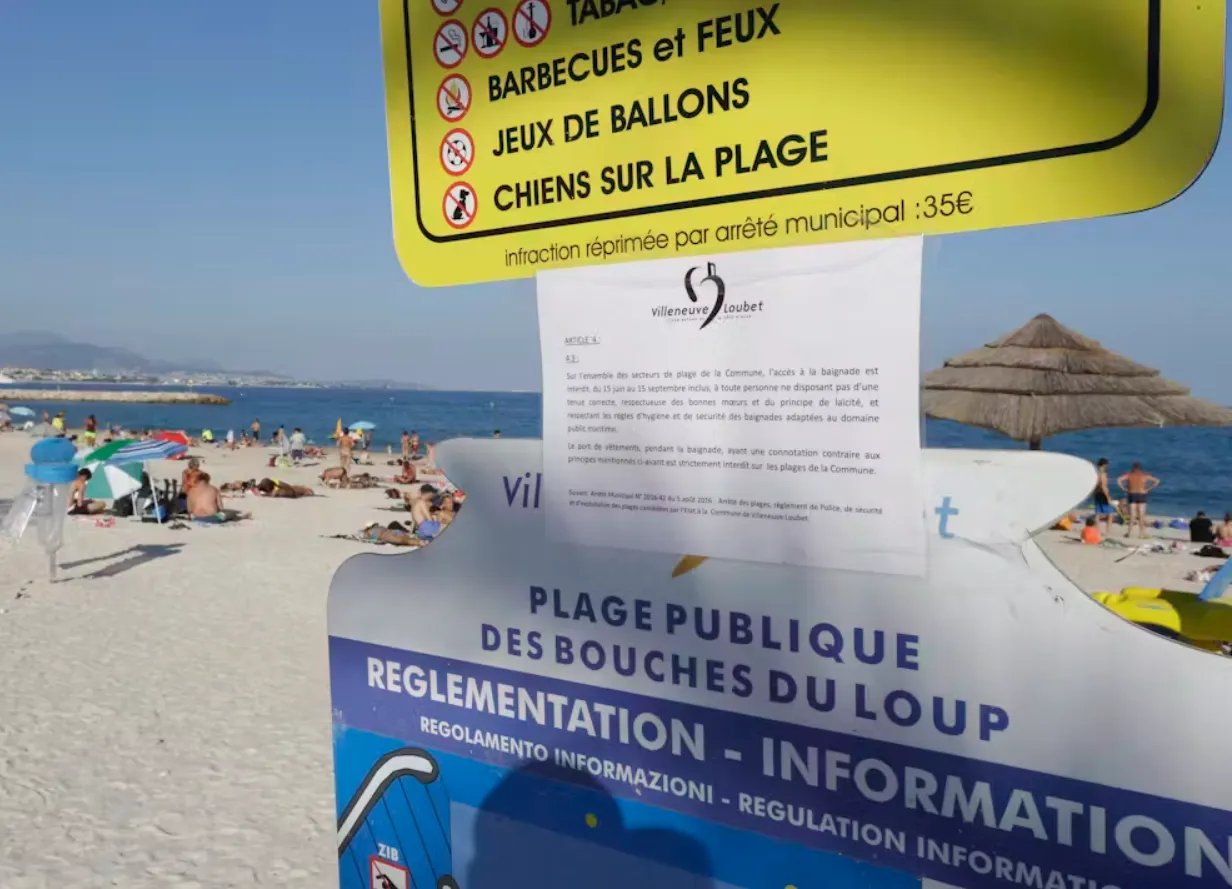  bylaw forbidding women to wear ‘burkinis’ posted at a public beach in Villeneuve-Loubet, southern France, in August 2016. France’s top administrative court later overturned the town’s bylaw amid a wave of global outrage. (AP Photo/Claude Paris)