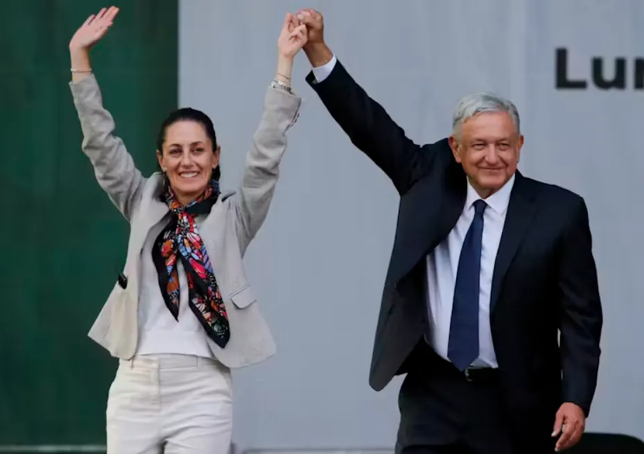 President Andres Manuel Lopez Obrador, right, and then-Mayor Claudia Sheinbaum, greet supporters at a rally in Mexico City in 2019. Fernando Llano/AP