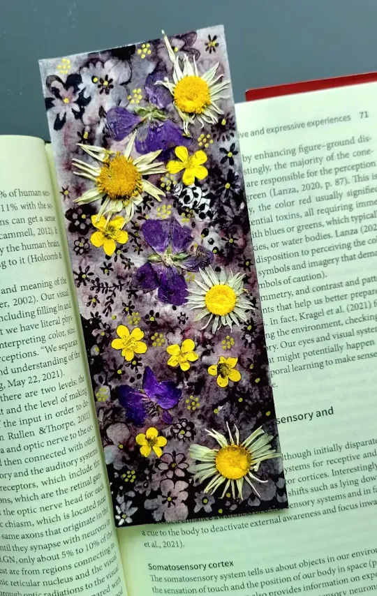 Bookmark made with wildflowers and ink drawing, created by Girija Kaimal. ‘My aim here was to capture the beauty of nature and the work of the human hand.’ Girija Kaimal