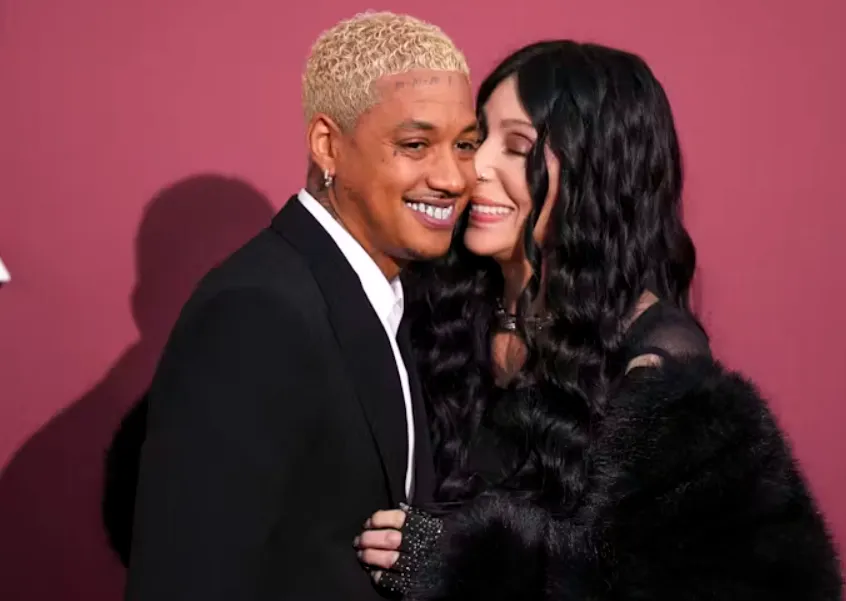 Singer Cher and her boyfriend, Alexander Edwards, pose for photographers during the 77th Cannes International Film Festival, Cap d'Antibes, southern France, May 23, 2024. (Scott A Garfitt/Invision/AP)