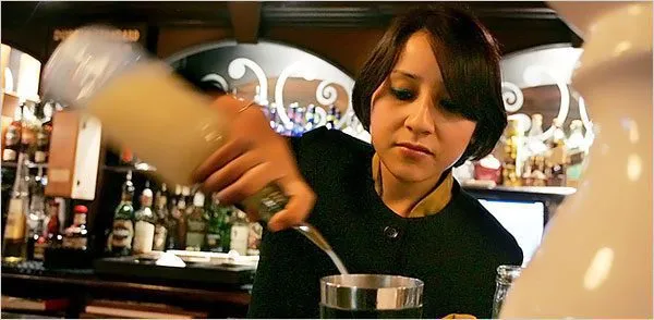 An Indian woman bartender