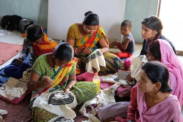 Women stitching in Aham Bhumika's embroidery class