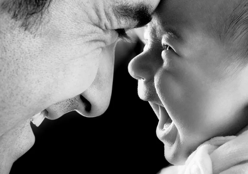 Father And Son Giggling. PIcture Credit: Image Thirst