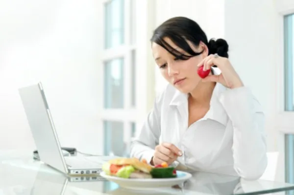 Woman eating at work