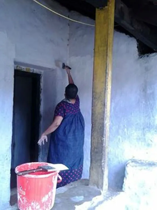 Women take charge of painting the house