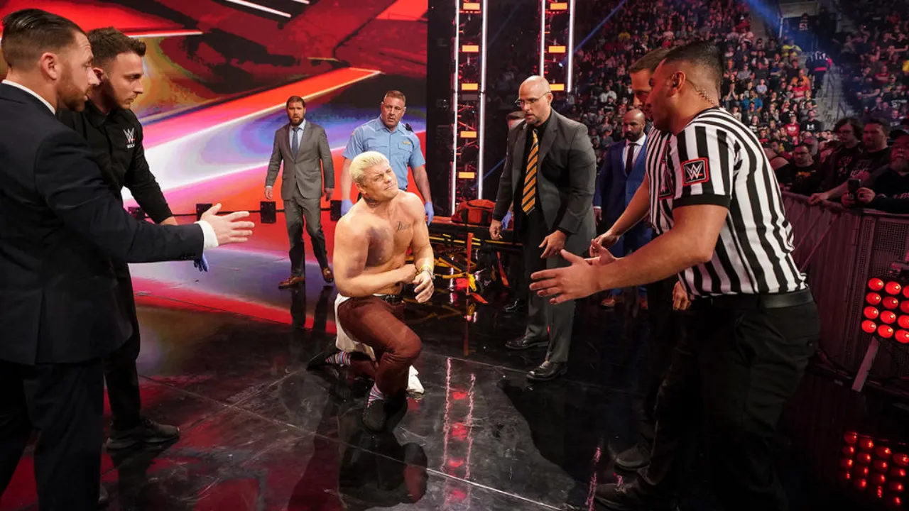 Roman Reigns attacking Cody Rhodes