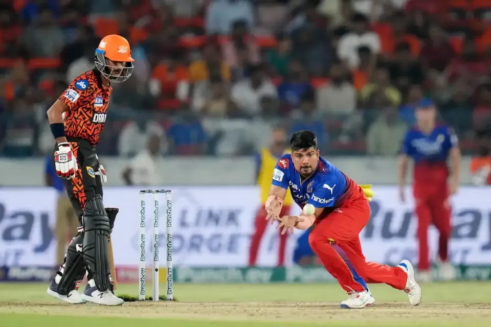 Karn Sharma takes a catch off his own bowling to dismiss Abdul Samad