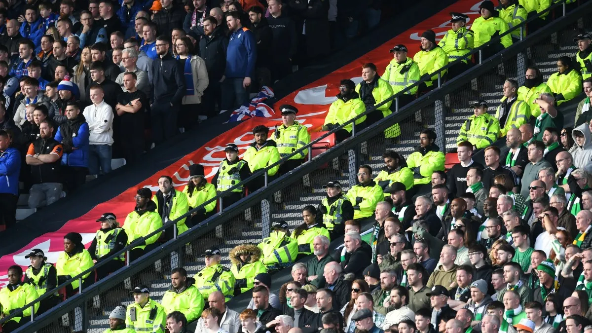 Police protecting the home and away fans during an Old Firm derby - sportzpoint.com