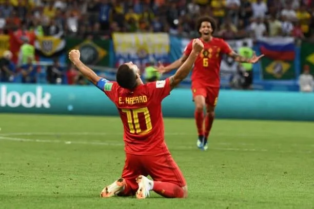 TOPSHOT - Belgium's forward Eden Hazard celebrates their win during the Russia 2018 World Cup quarter-final football match between Brazil and Belgium at the Kazan Arena in Kazan on July 6, 2018. - Belgium beat World Cup favourites Brazil 2-1 on Friday to set up a semi-final against France in Saint Petersburg. (Photo by Jewel SAMAD / AFP)  
