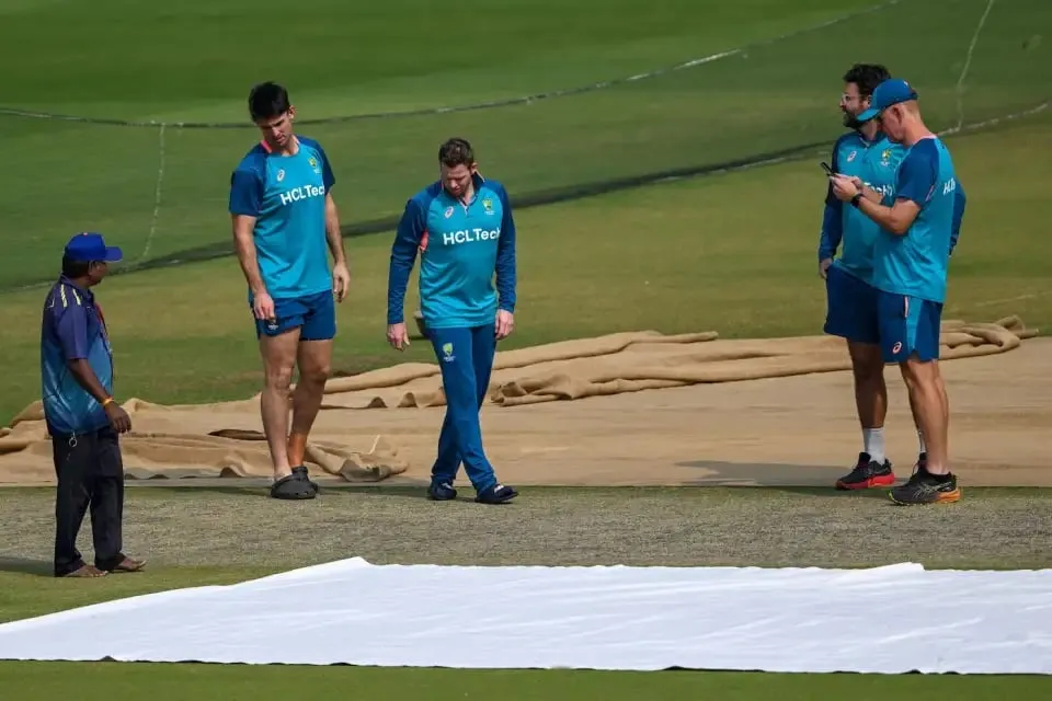 Members of the Australia set-up investigate the pitch  Image - AFP/Getty