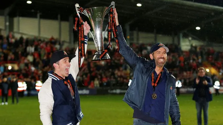 Wrexham | Rob McElhenney and Ryan Reynolds celebrate with the National League trophy| Sportz Point. 
