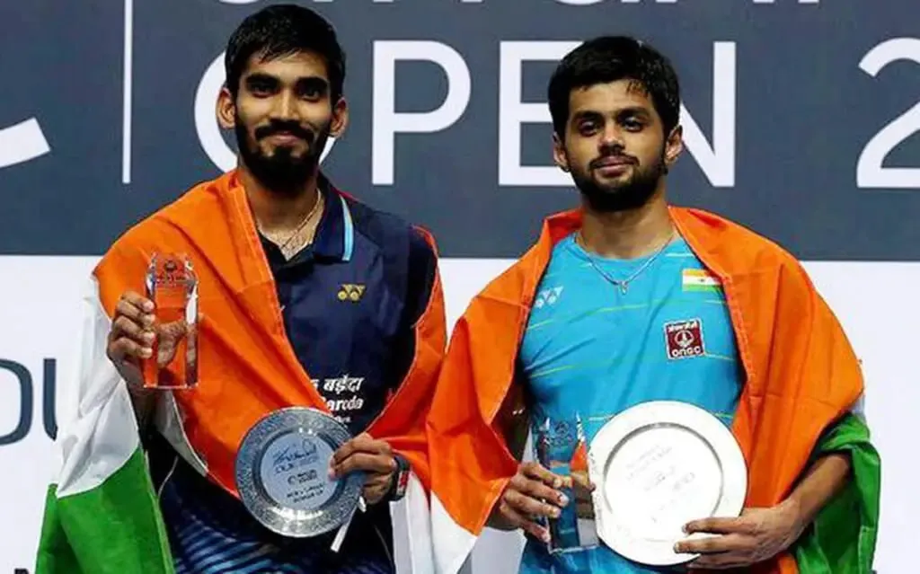 Kidambi Srikanth and Sai Praneeth pose on podium of the Singapore Open 2022 final. Praneeth won his first-ever super series tournament. | Indian Badminton News | Sportz Point