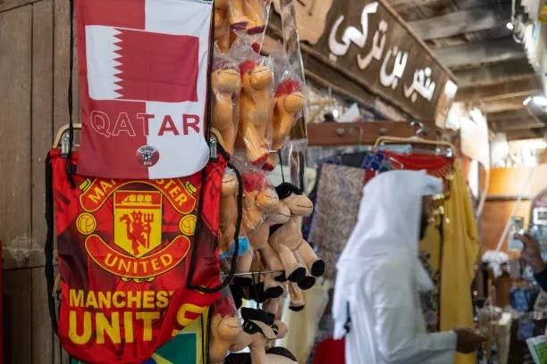 DOHA, QATAR - FEBRUARY 22: A Manchester United bag on sale in the Souq Waqif in the capital of Doha in Qatar after the announcement that Sheikh Jassim Bin Hamad Al Thani confirmed his submission of a bid to buy Manchester United Football Club from the Glazer Family from the USA on February 18, 2023 in Doha, Qatar. (Photo by Matthew Ashton - AMA/Getty Images)  
