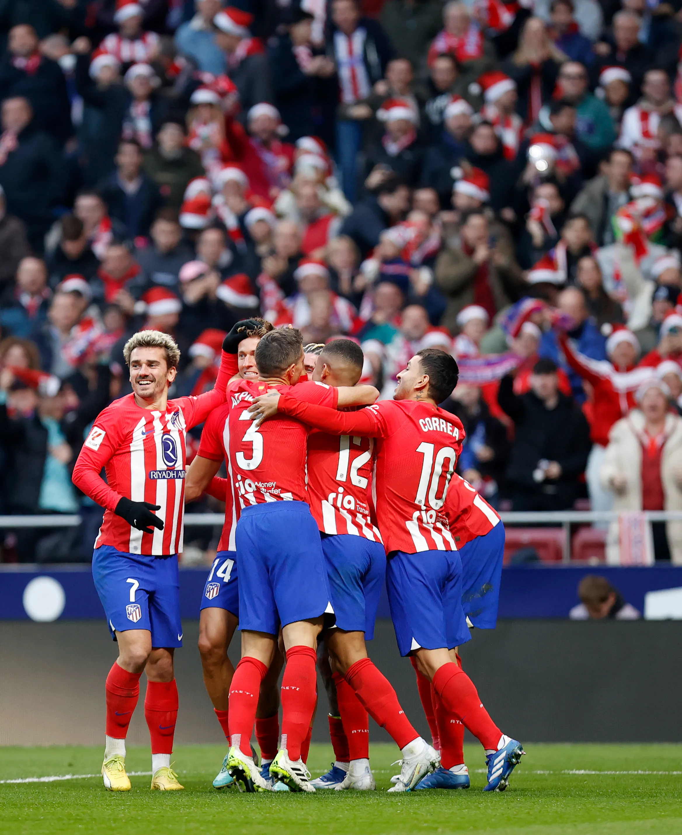 Atletico Madrid player celebrating their thrid goal of the match.  