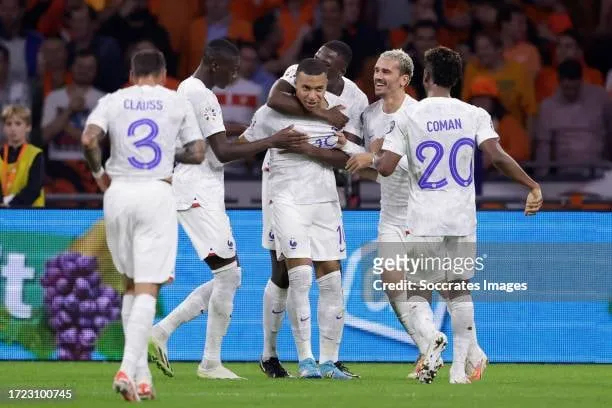 AMSTERDAM, NETHERLANDS - OCTOBER 13: Kylian Mbappe of France celebrates 0-2 with Ibrahima Konate of France, Antoine Griezmann of France Kingsley Coman of France, Jonathan Clauss of France during the EURO Qualifier match between Holland v France at the Johan Cruijff Arena on October 13, 2023 in Amsterdam Netherlands (Photo by Rico Brouwer/Soccrates/Getty Images)  