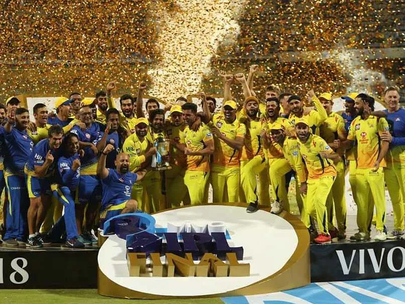 Chennai Super Kings with IPL trophy in 2018 | Number of matches each team needs to win to qualify for playoffs | IPL 2021 | SportzPoint.com<br />
