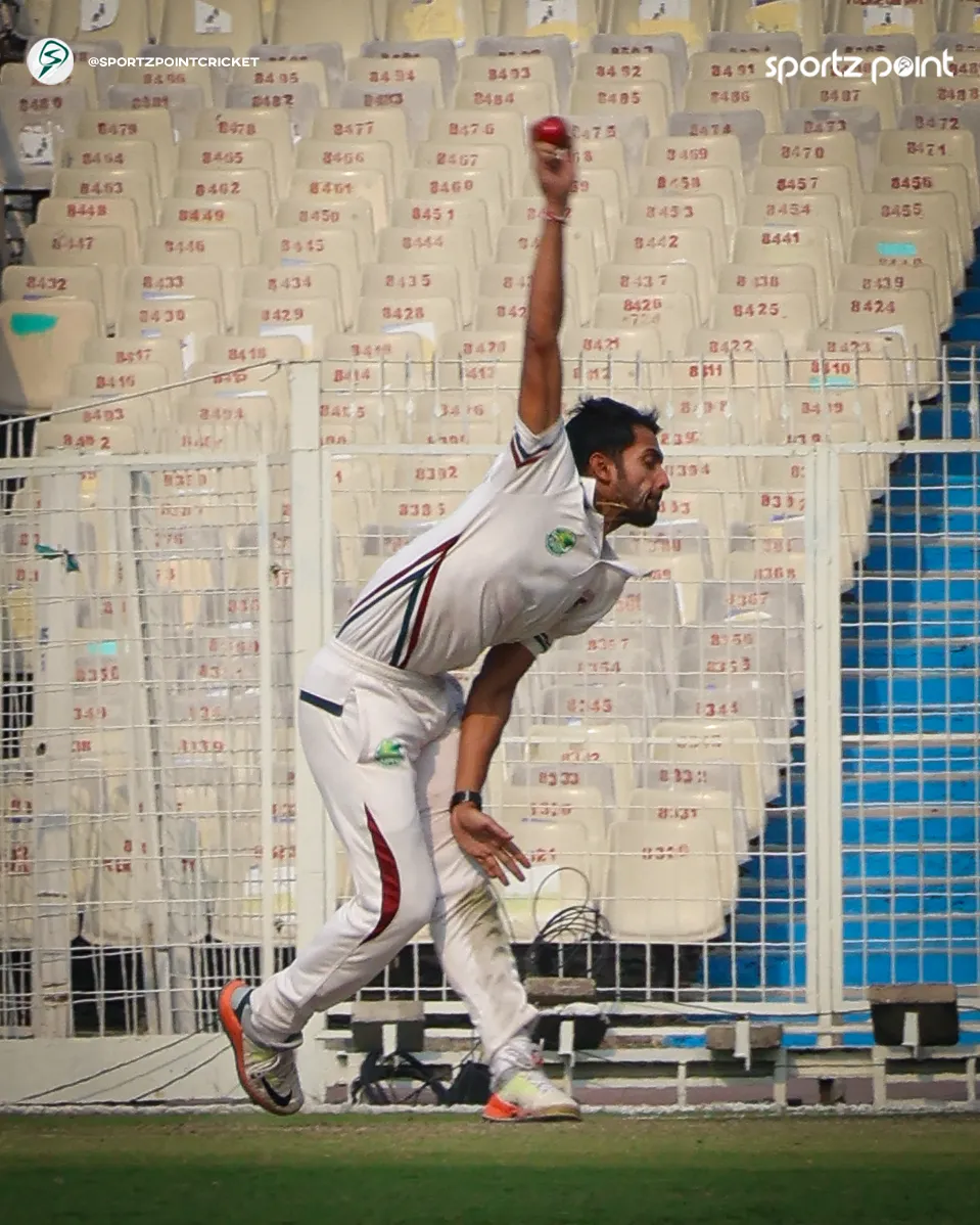 Sayan Shekhar Mondal in his bowling action in the East Bengal vs Mohun Bagan match.  