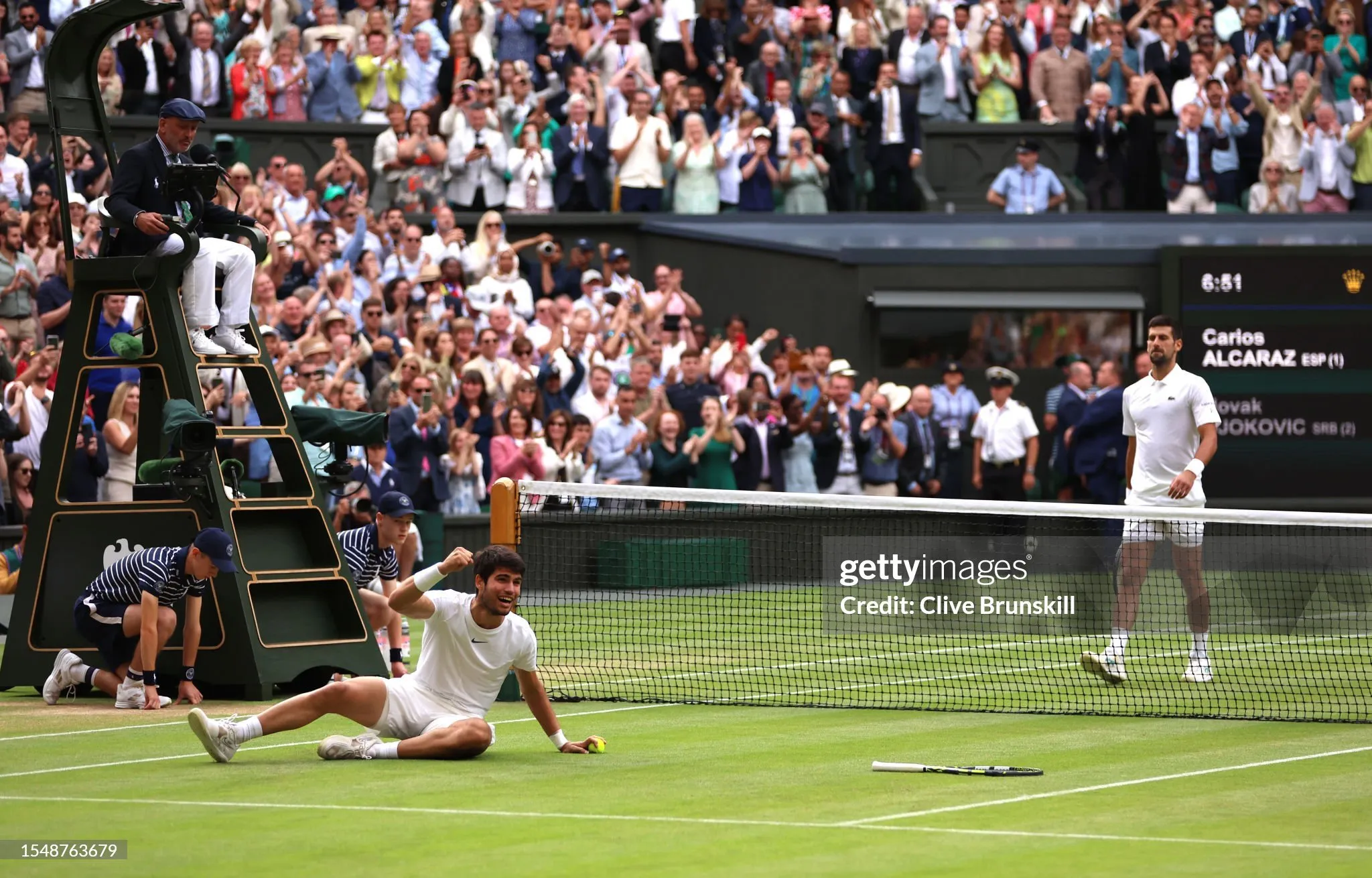 Carlos Alcaraz of Spain celebrates winning Championship point in the Men's Singles Final against Novak Djokovic of Serbia on day fourteen of The Championships Wimbledon 2023 at All England Lawn Tennis and Croquet Club on July 16, 2023 in London, England.   Photo by Clive Brunskill/Getty Images.