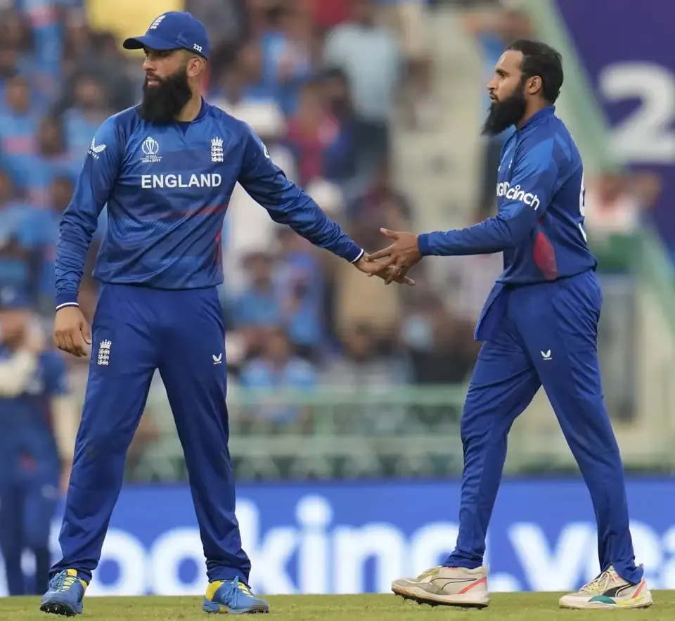 Moeen Ali and Adil Rashid celebrate Rohit Sharma's wicket  Image - Associated Press