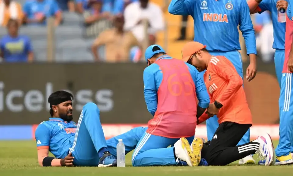 Hardik Pandya gets treatment after injuring his ankle  Image - ICC via Getty