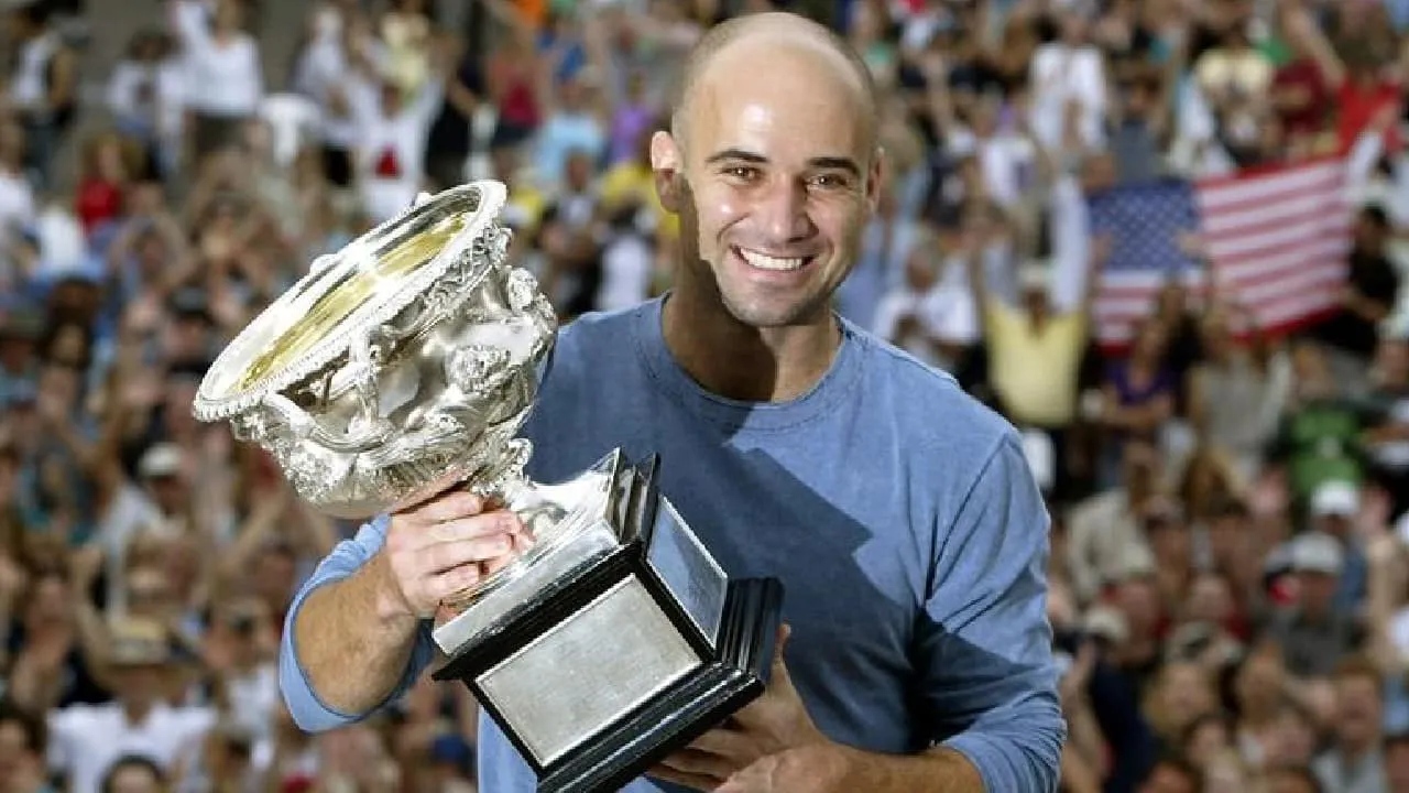 Andre Agassi with the US Open Title-Sportzpoint