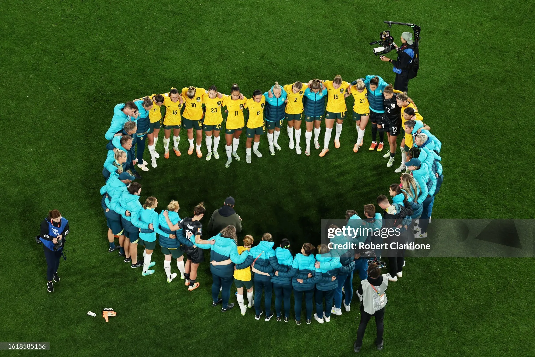 SYDNEY, AUSTRALIA - AUGUST 16: Australia players huddle after the team's 1-3 defeat following the FIFA Women's World Cup Australia & New Zealand 2023 Semi Final match between Australia and England at Stadium Australia on August 16, 2023 in Sydney, Australia.  Photo by Robert Cianflone/Getty Images.