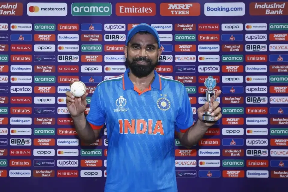 Mohammed Shami, the first Indian to pick a seven-for in a World Cup game, poses with his prize  Image - ICC via Getty