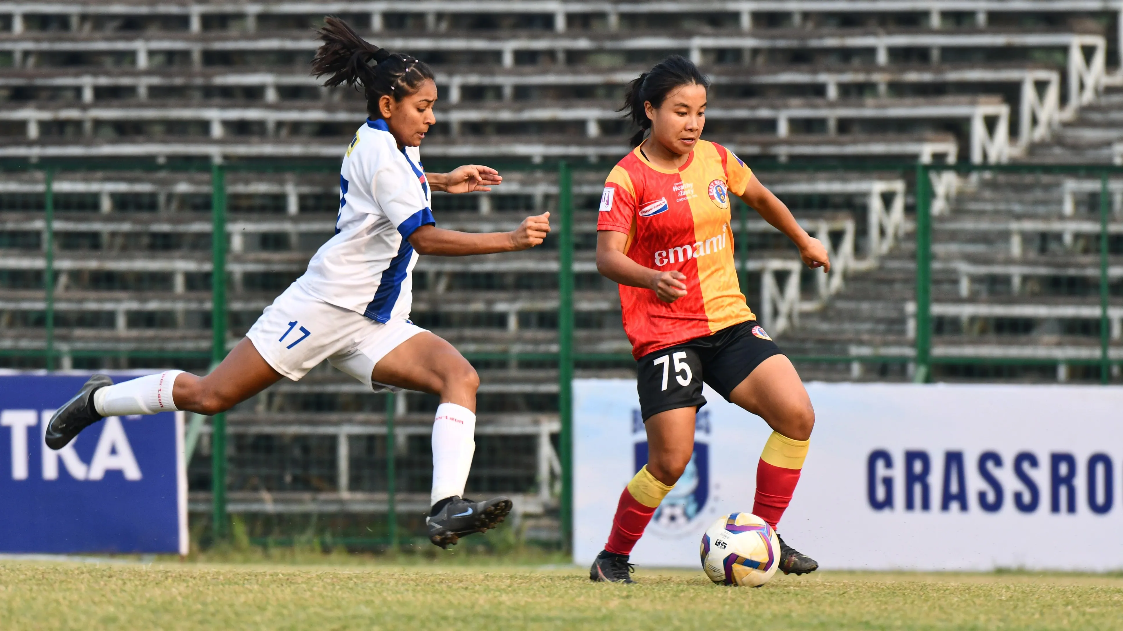 East Bengal FC's Margaret Devi fighting out for a ball against HOPS FC defender Mamta in the IWL 2023-24 match between East Bengal and HOPS FC in Kolkata.  